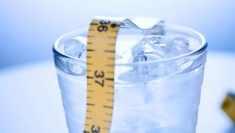 glass of water with measuring tape