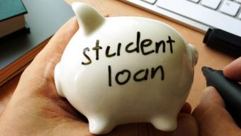 piggy bank with "student loan" written on it