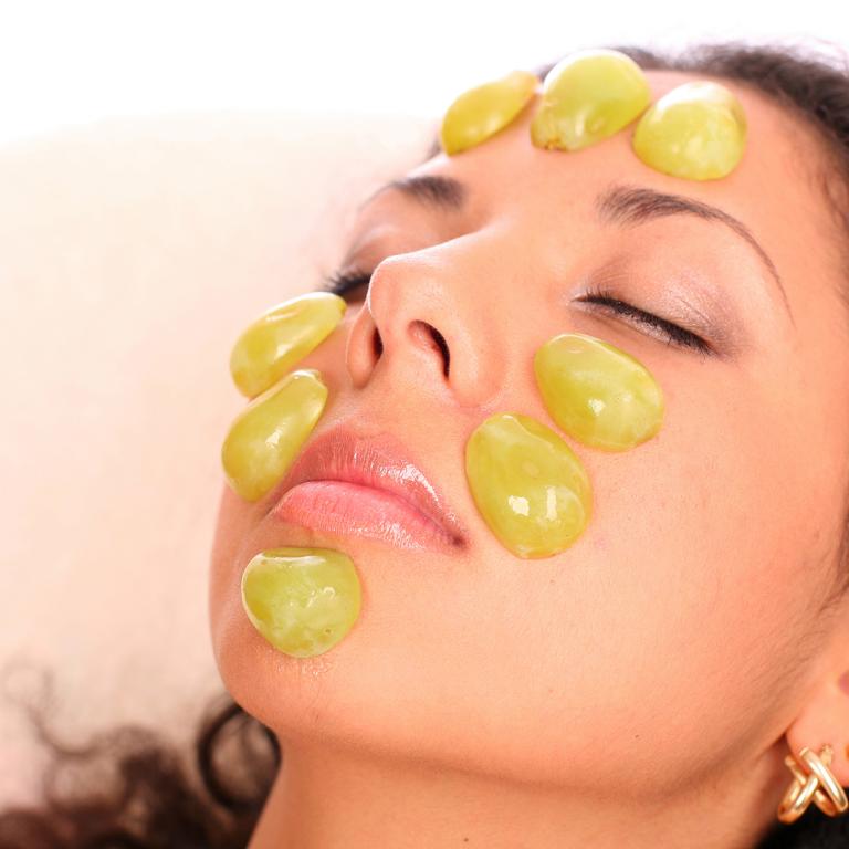 grapes on face
