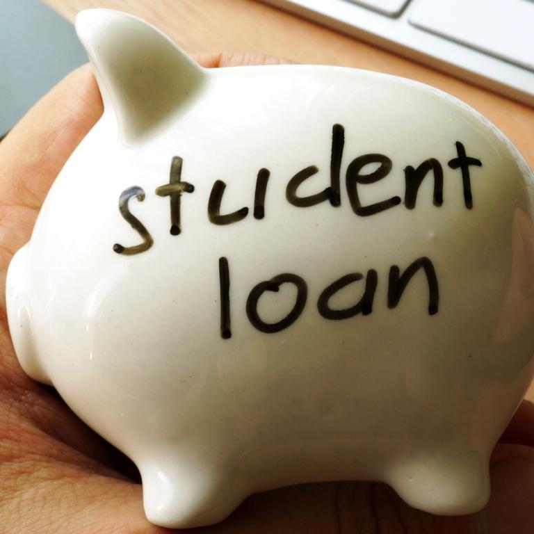piggy bank with "student loan" written on it