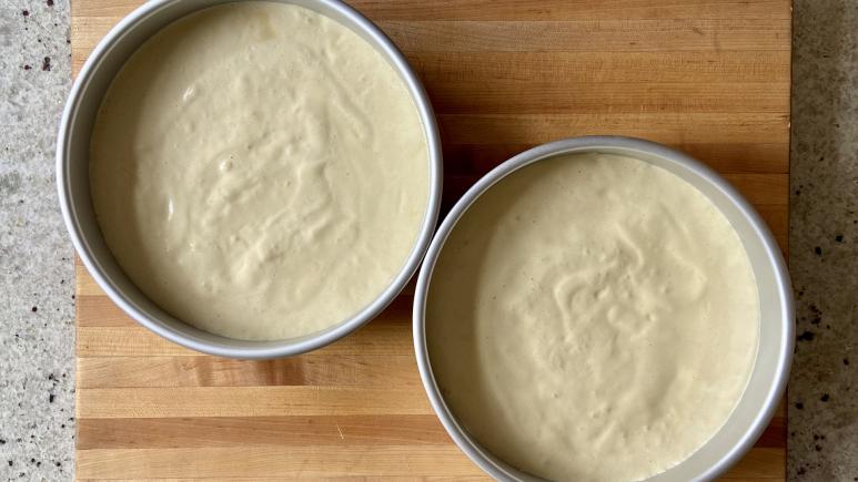raw batter in cake pans